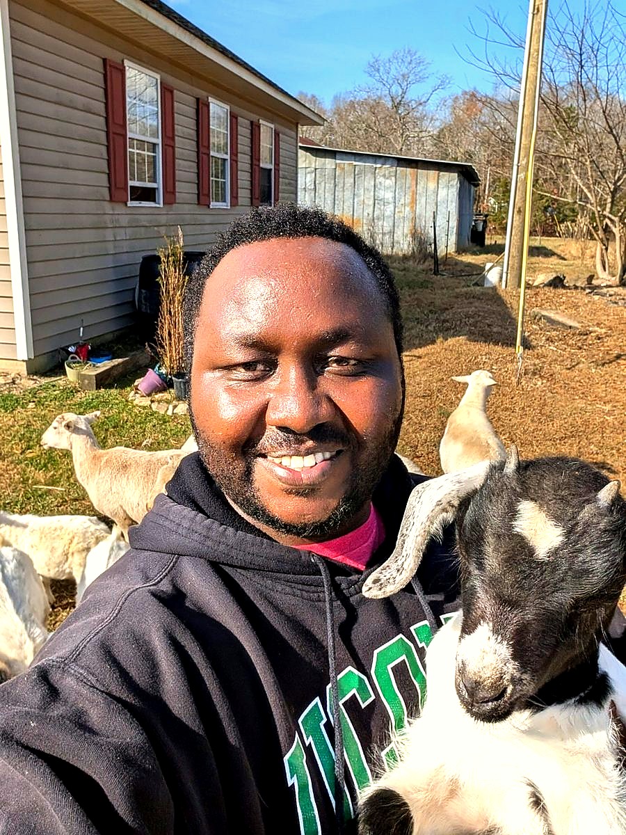 Farmer with goat